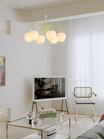 Green lampbody chandelier suspend on a room with TV