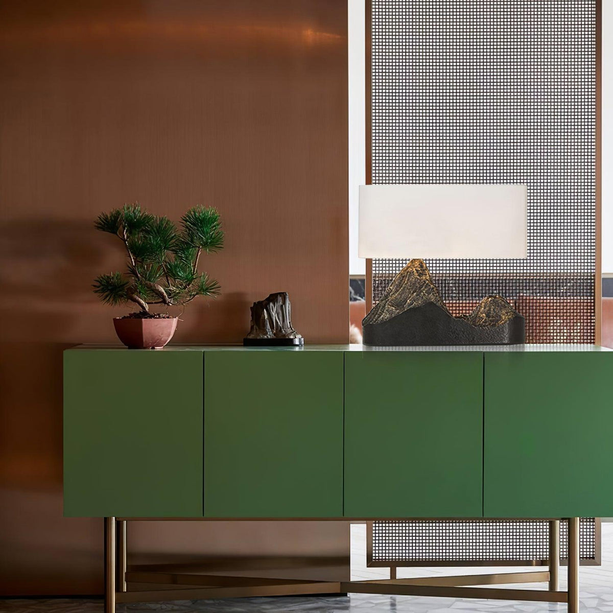 <img src="TamHillsTableLamp_lunrlighting_9.jpg"alt="A table lamp on a green table"/>  
